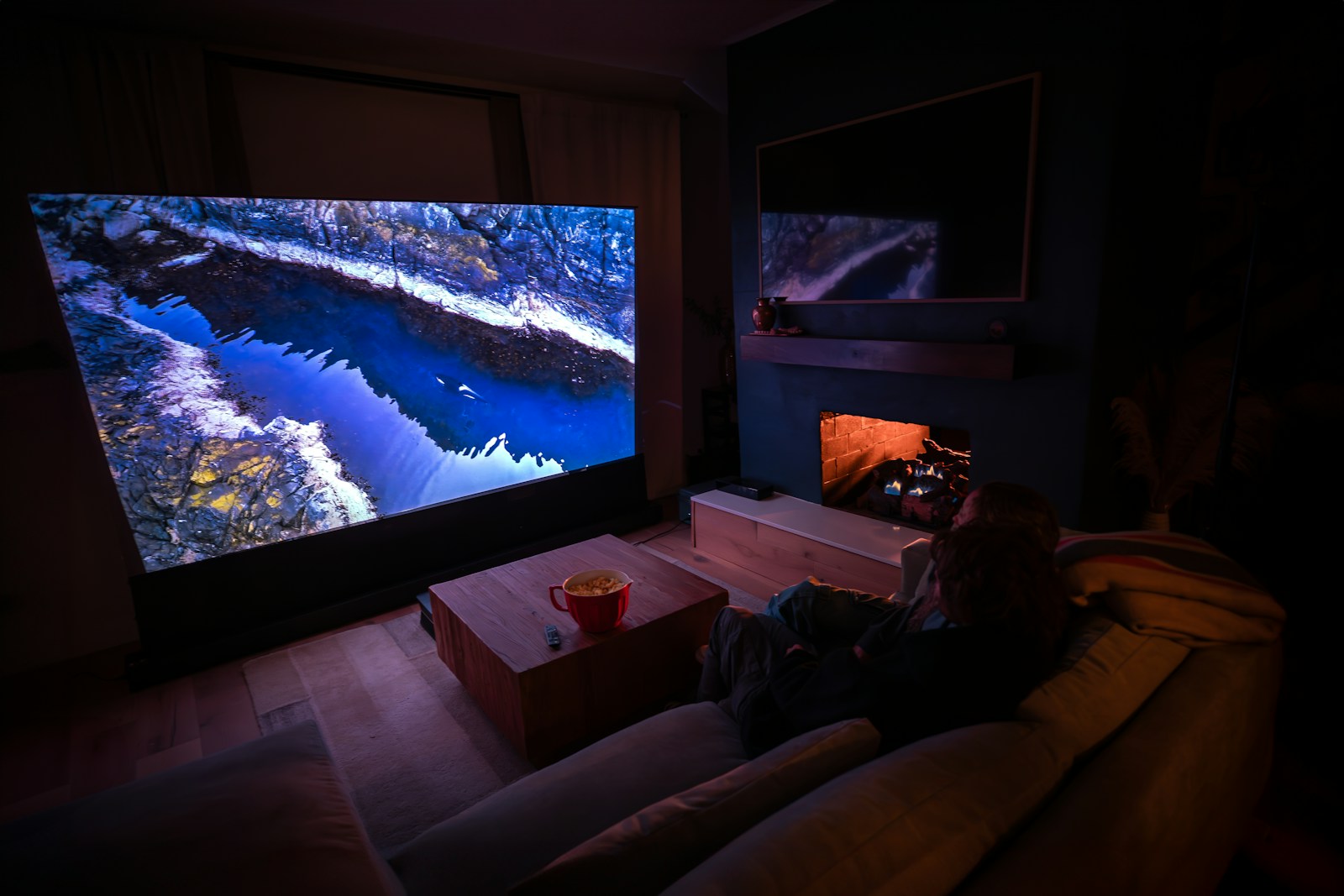 A home cinema room with a lit screen — stock photograph
