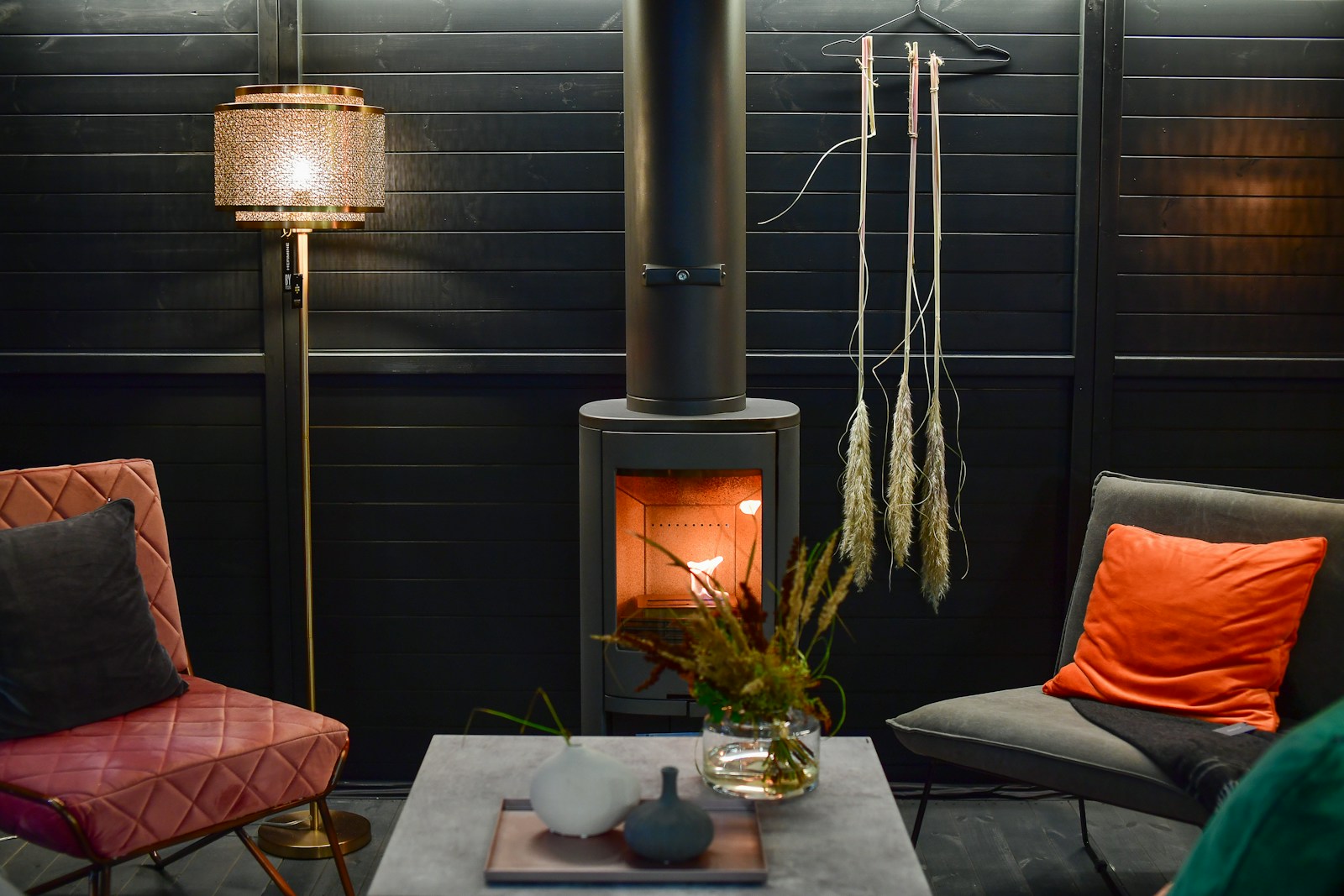 A lit stove and a shaded lamp — stock photograph