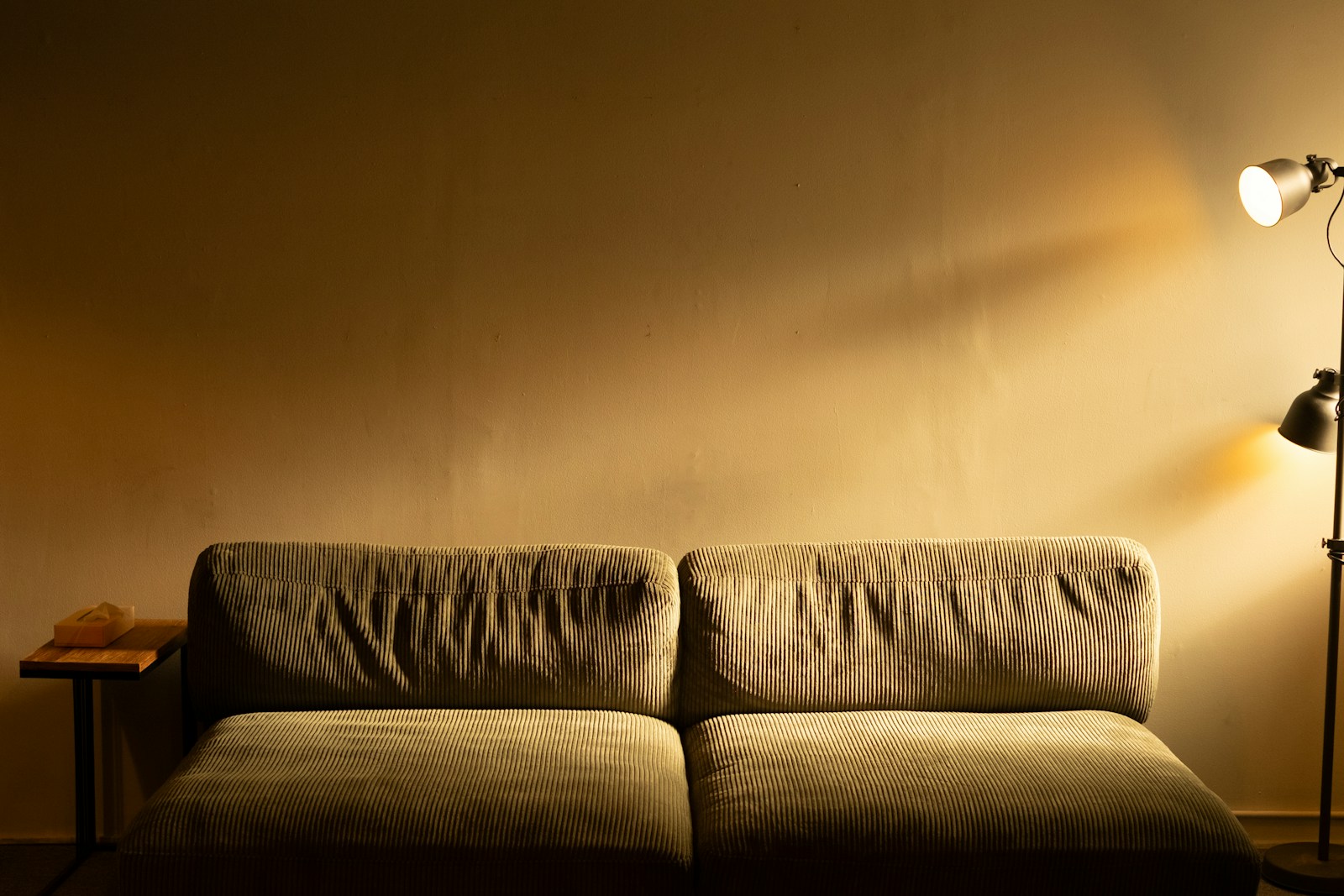 A warm wash of light across a wall — stock photograph