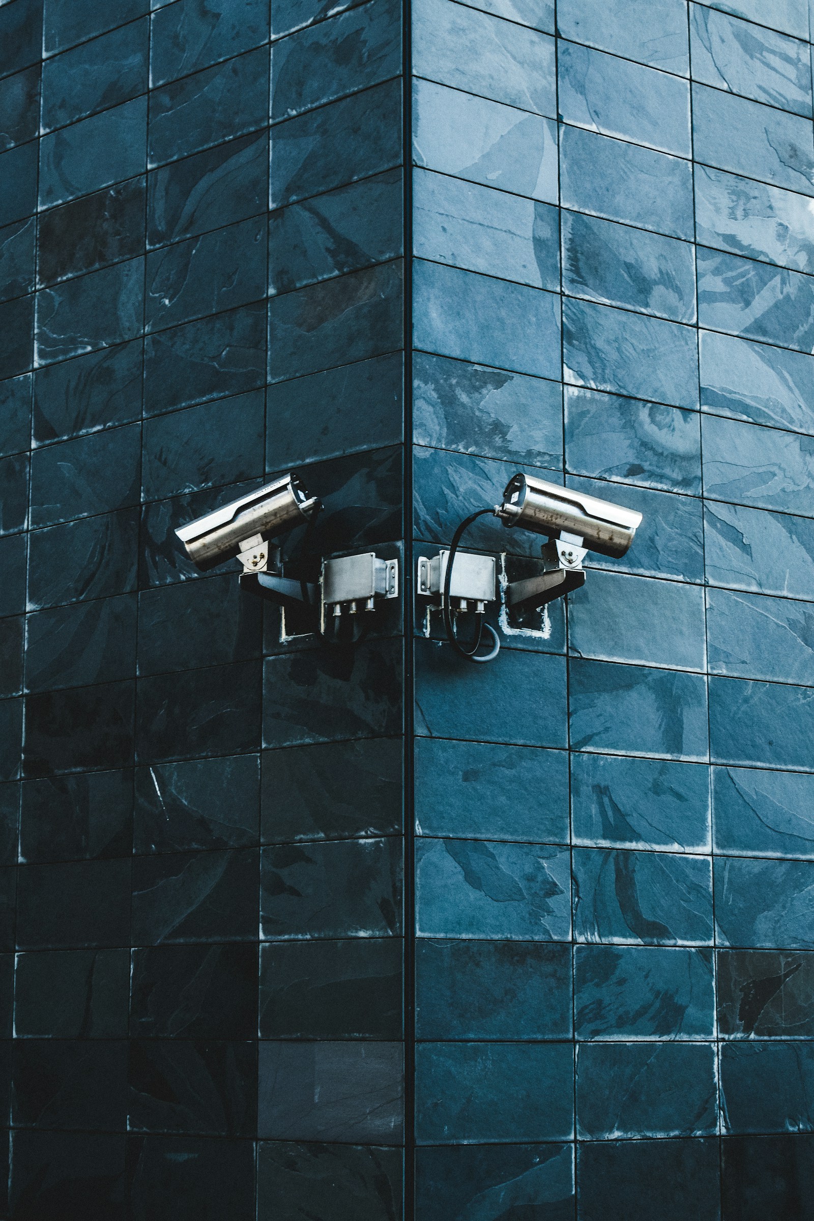 An IP camera mounted on a wall — stock photograph